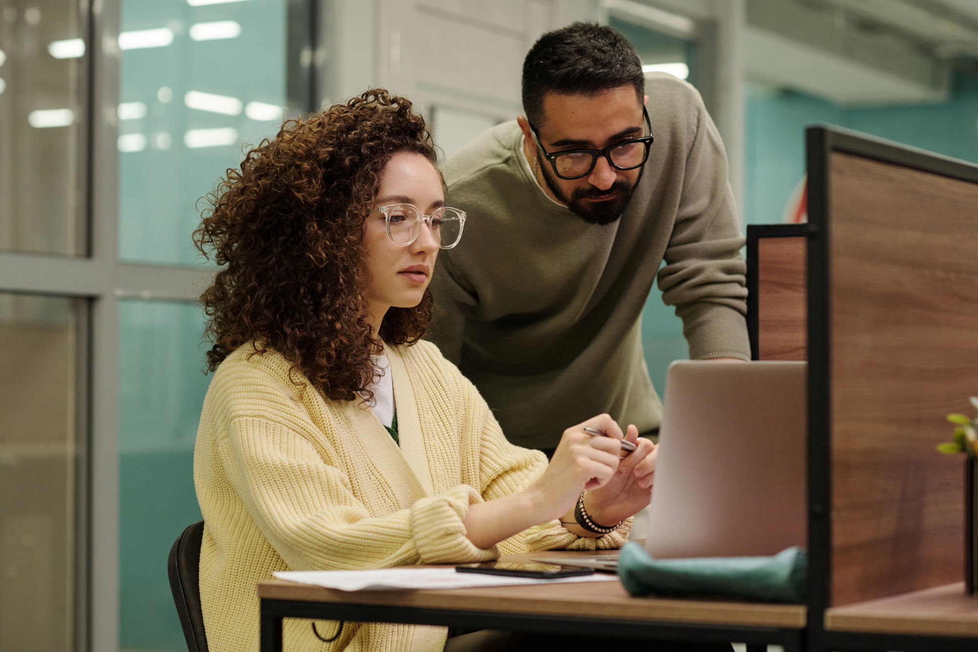 Engineers reviewing custom workforce software on screen