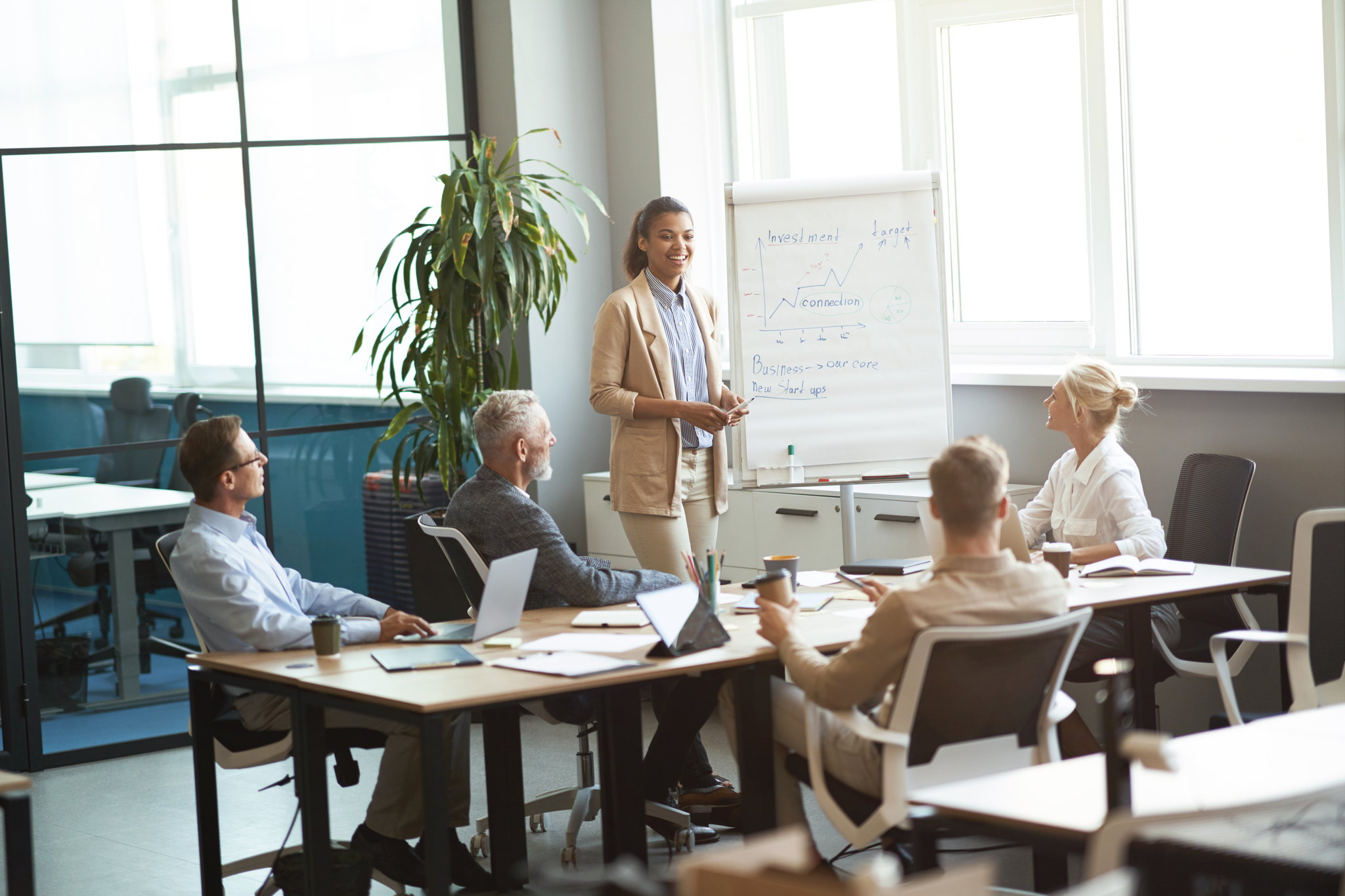 Advisor reviewing group insurance options with clients