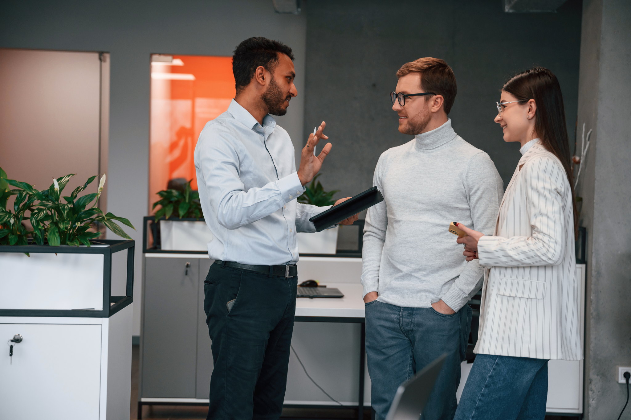 Accelerated advisors in conversation at the office